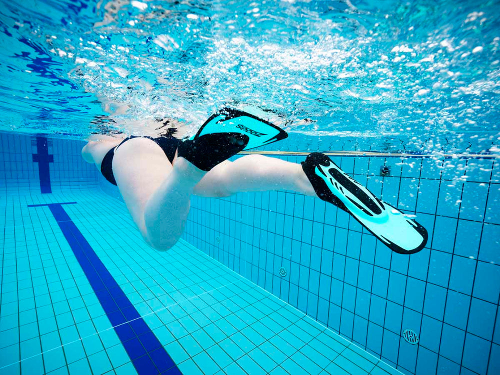 Turquoise Zoggs Swim Fin Energy for swimming training and performance, featuring a sleek fin design for water propulsion.