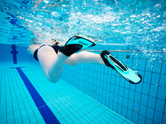 Turquoise Zoggs Swim Fin Energy for swimming training and performance, featuring a sleek fin design for water propulsion.