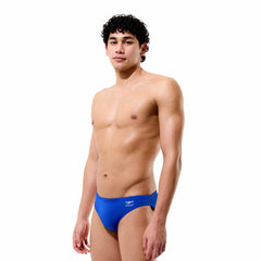 Speedo men's solid brief in calm cobalt, showing a close-up of the snug, supportive swimwear fabric with the Speedo logo.