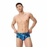Speedo men's printed 13.5cm brief in canyon ombre and black, featuring a comfortable fit and bold colorful design.