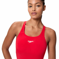 Speedo Women's Endurance+ Legsuit in High Risk Red, close-up of the red swimsuit fabric and sleek design for competitive swimming.