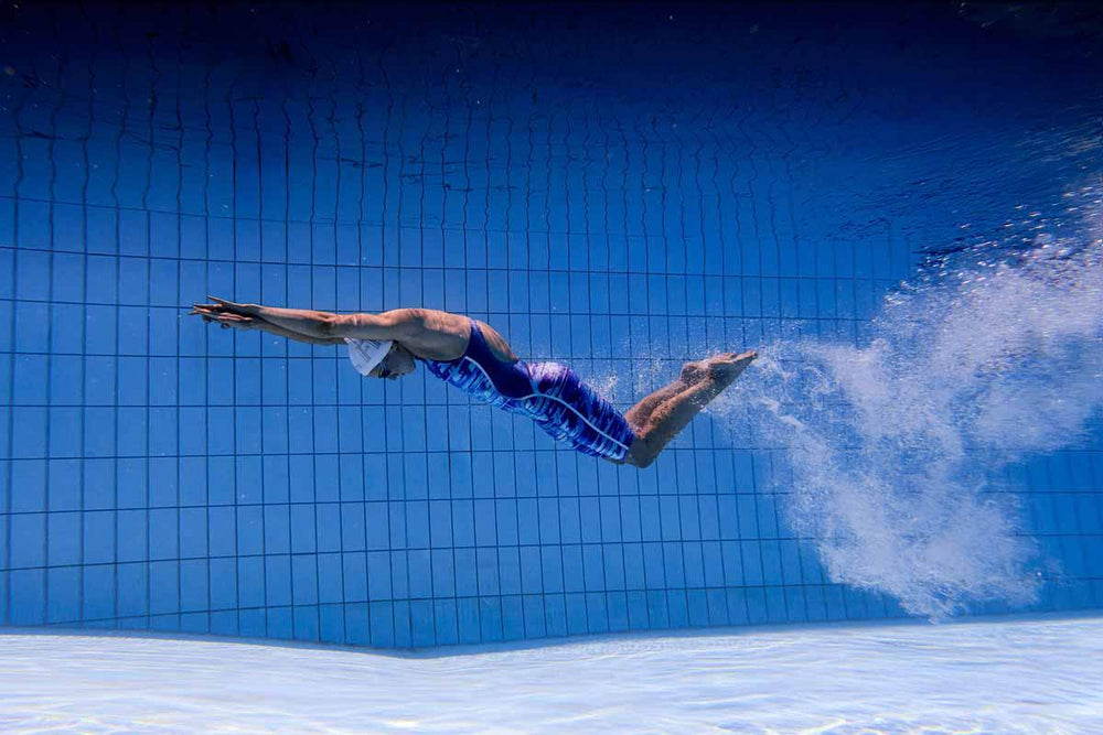 Funkita women's Apex Oblivion Pace Racer kneesuit in blue, featuring sleek athletic design and comfortable fit for competitive swimming.
