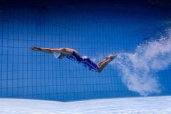 Funkita women's Apex Oblivion Pace Racer kneesuit in blue, featuring sleek athletic design and comfortable fit for competitive swimming.