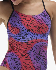 TYR Women's Hodori Cutoutfit Swimsuit in orange and purple, featuring a stylish design with cutouts and sleek swimwear details.