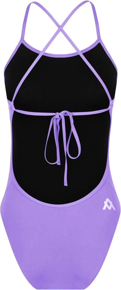 Amani Womens Iris purple tie-back one-piece swimsuit with a sleek fit and stylish design, shown on a model.