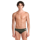 Arena men's team solid swim briefs in dark sage and white, featuring a snug fit and durable fabric for competitive swimming.