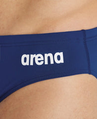 Navy blue Arena men's team swim briefs with a solid design, made for competitive swimming and athletic performance.