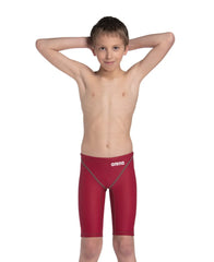Arena Boys Powerskin ST Next Jammer in deep red, close-up of the competitive swim jammers with sleek fabric and branding details.
