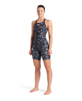 Arena women's printed full-body swimsuit in black and multi-color design, shown as a stylish kneesuit for swimwear.