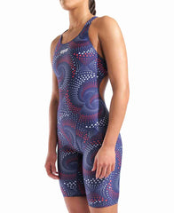 Arena women's printed full-body kneesuit featuring red, white, and blue team colors, designed for competitive swimming.