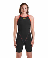Arena Women's Indomitus Powerskin Primo kneesuit in black and multi-color, designed for competitive swimming, featuring a sleek, form-fitting design.