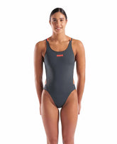 Arena women's solid Tech Back swimsuit in Asphalt and Bright Coral, featuring a sleek design and supportive fit.