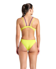 Arena women's solid tech back swimsuit in soft green and plum, featuring a sleek design and supportive fit.