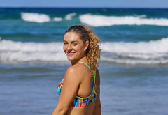 Funkita Ladies The Glitch sports top, a colorful bikini/tankini top with vibrant pattern, designed for active swimwear.