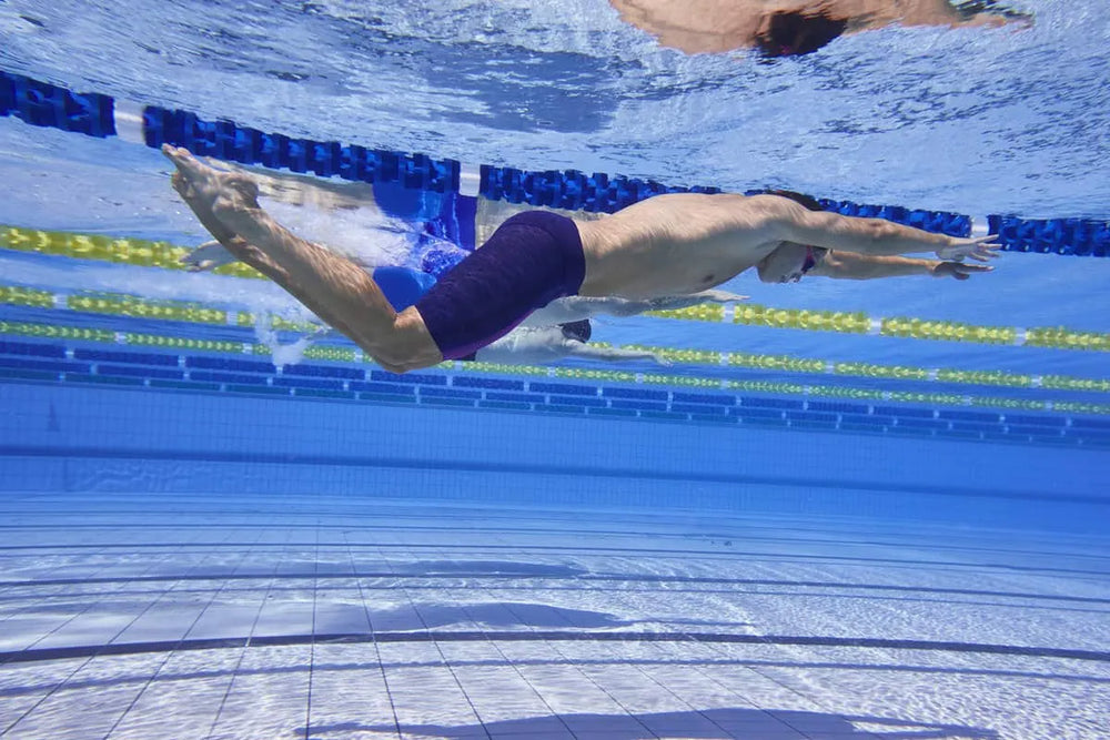 Funky Trunks men's Tidal Blast Apex Viper jammer swim trunks in navy and pink with a bold, sporty design.