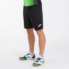 Black Joma Boys Nobel shorts made of lightweight fabric, featuring an elastic waistband and sporty design for active wear.