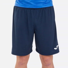 Dark navy Joma Boys Nobel shorts made of lightweight fabric, featuring an elastic waistband and sporty design.