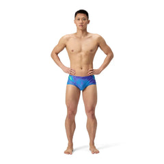 Speedo men's ML printed 13.5cm briefs in Under Current and Sugar Blue with colorful geometric pattern.