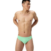 Speedo men's solid brief in Alfalfa Green, colorful swimwear with a snug fit, featuring the Speedo logo on the waistband.