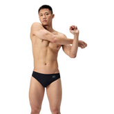 Speedo men's ML solid brief in Team Black, showing a close-up of the black swim brief with sleek design and elastic waistband.