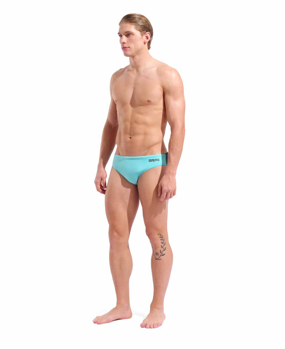 Arena men's swim briefs in solid water/asphalt color, featuring a snug fit and durable fabric for competitive swimming.