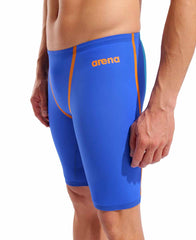Arena men's Powerskin Primo jammer in neon blaze, close-up showing sleek, form-fitting swimwear with branded logo and vibrant color.