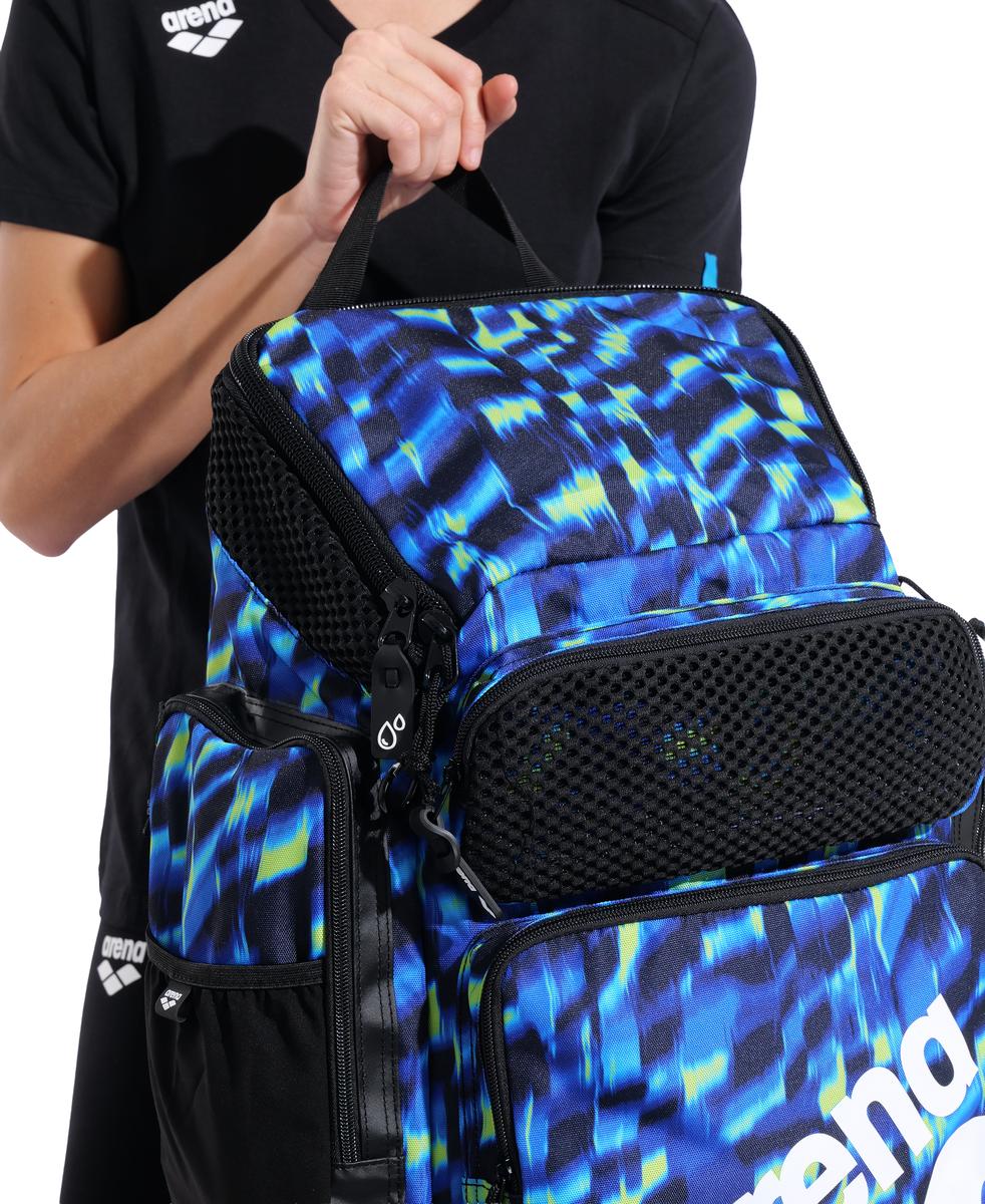 Arena One Go Allover Backpack 45L in Aqua and Gleam, shown with multiple compartments and adjustable straps.