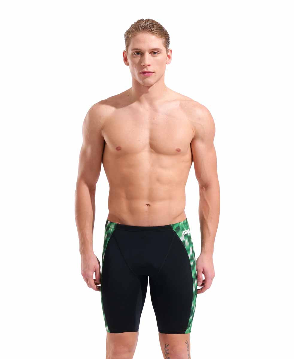 Black and green Arena men's Wave swim jammer, close-up view showing sleek, fitted swimwear for competitive swimming.