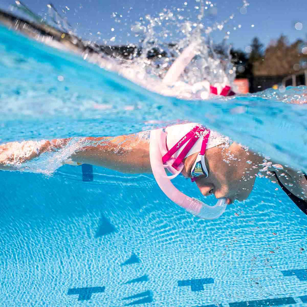 Finis Stability Snorkel in orchid color, designed for comfortable underwater breathing, shown with adjustable straps and mouthpiece.