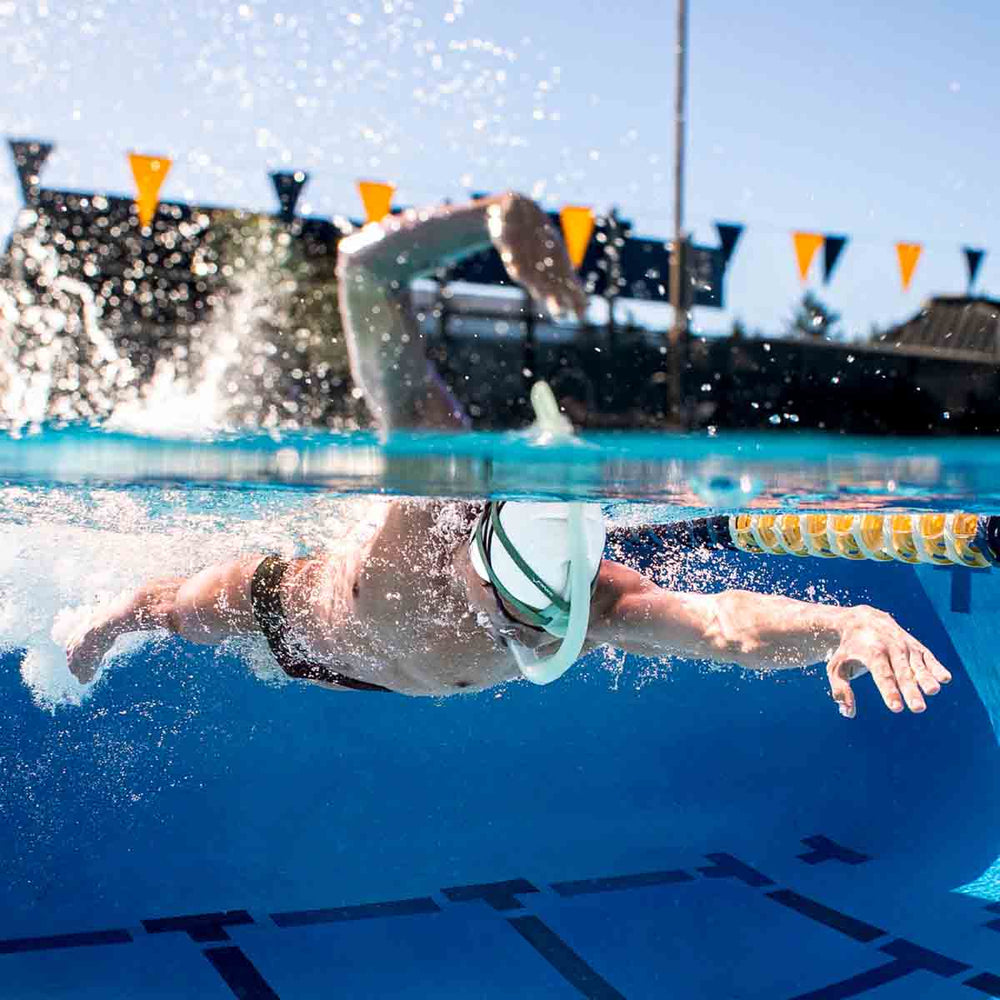 Finis Stability Snorkel in sage green, featuring a streamlined design for comfortable breathing during swim training.