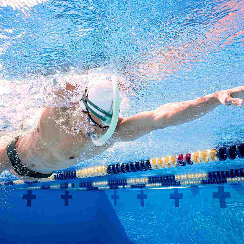 Finis Stability Snorkel in sage green, designed for comfortable underwater breathing during swimming training.