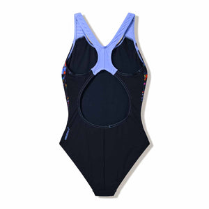 Speedo girls' print splashback swimsuit in anthracite and moonlight lavender with colorful aquatic patterns.