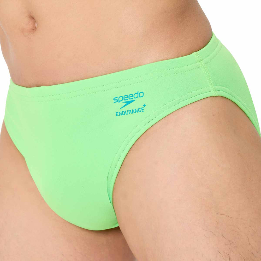 Speedo men's solid brief in screaming green, made of quick-drying swim fabric, featuring a comfortable fit and classic design.