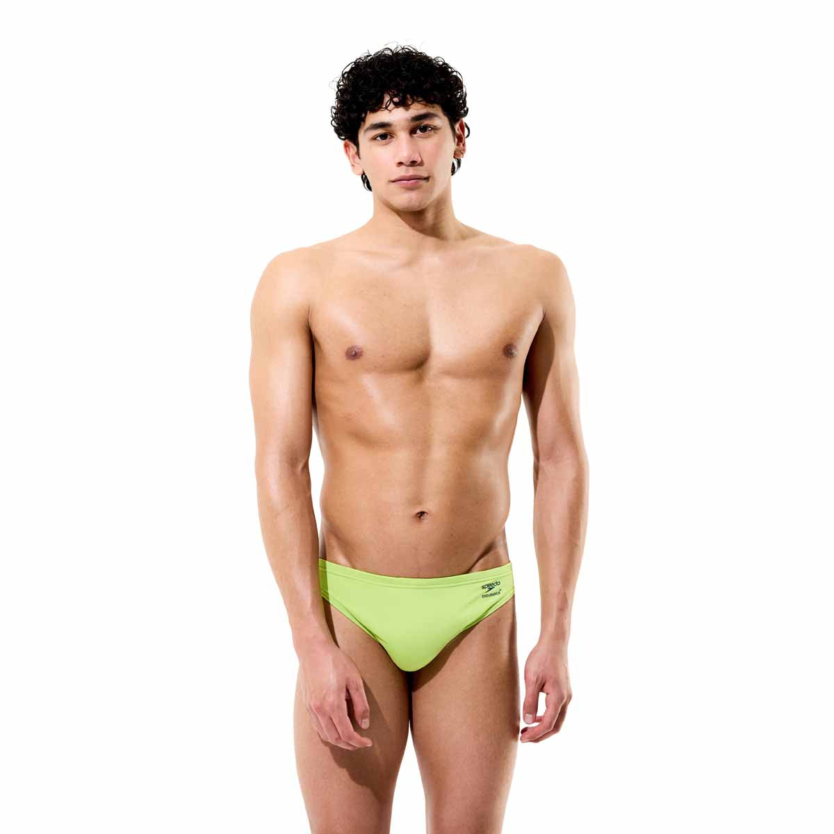 Speedo men's solid citrus green briefs showing a snug fit, with elastic waistband and smooth fabric for swimming or beachwear.