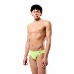 Speedo men's solid citrus green swim briefs, snug fit with elastic waistband, designed for comfortable swimwear.