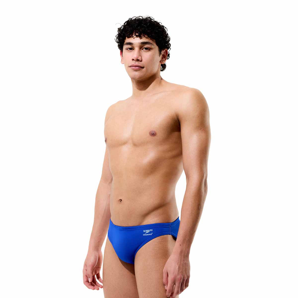 Speedo men's solid brief in calm cobalt, showing a close-up of the snug, supportive swimwear fabric with the Speedo logo.