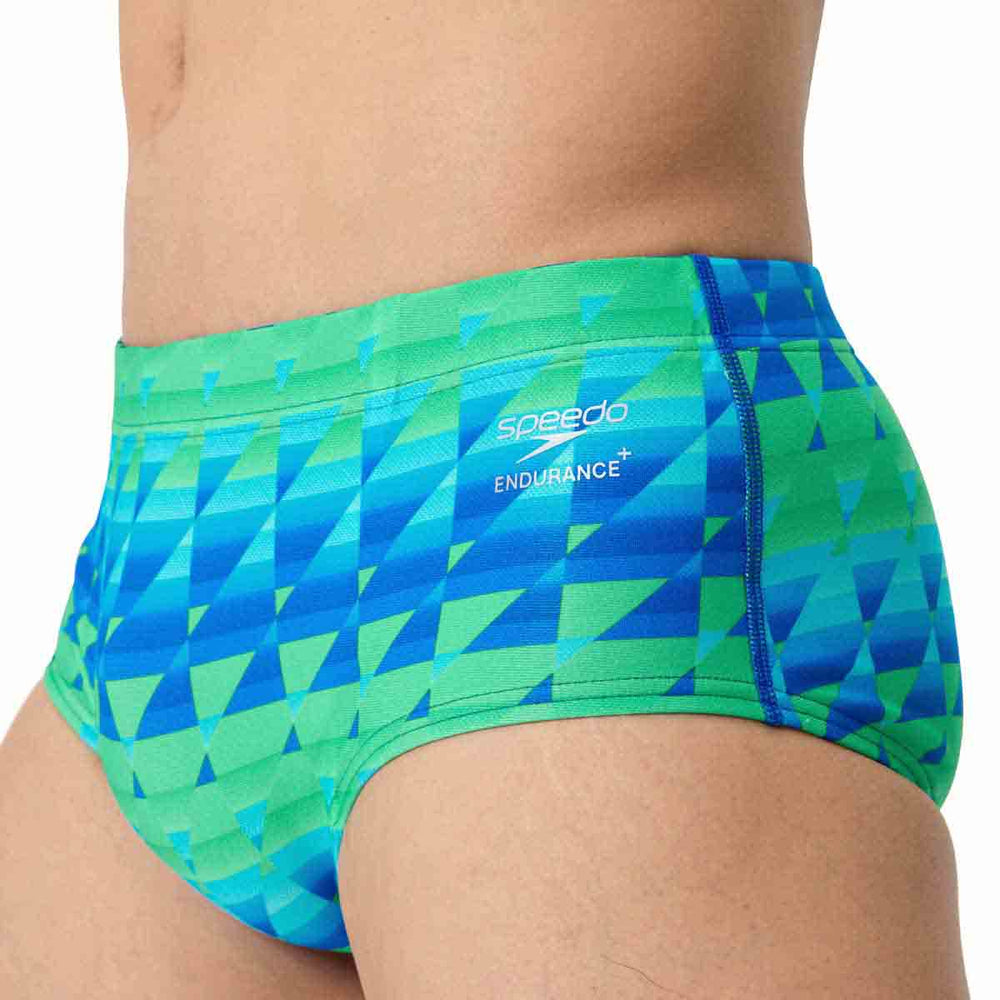 Speedo men's printed 13.5cm briefs with quilt triangle pattern in blue and green, showcasing the stylish swimwear design.