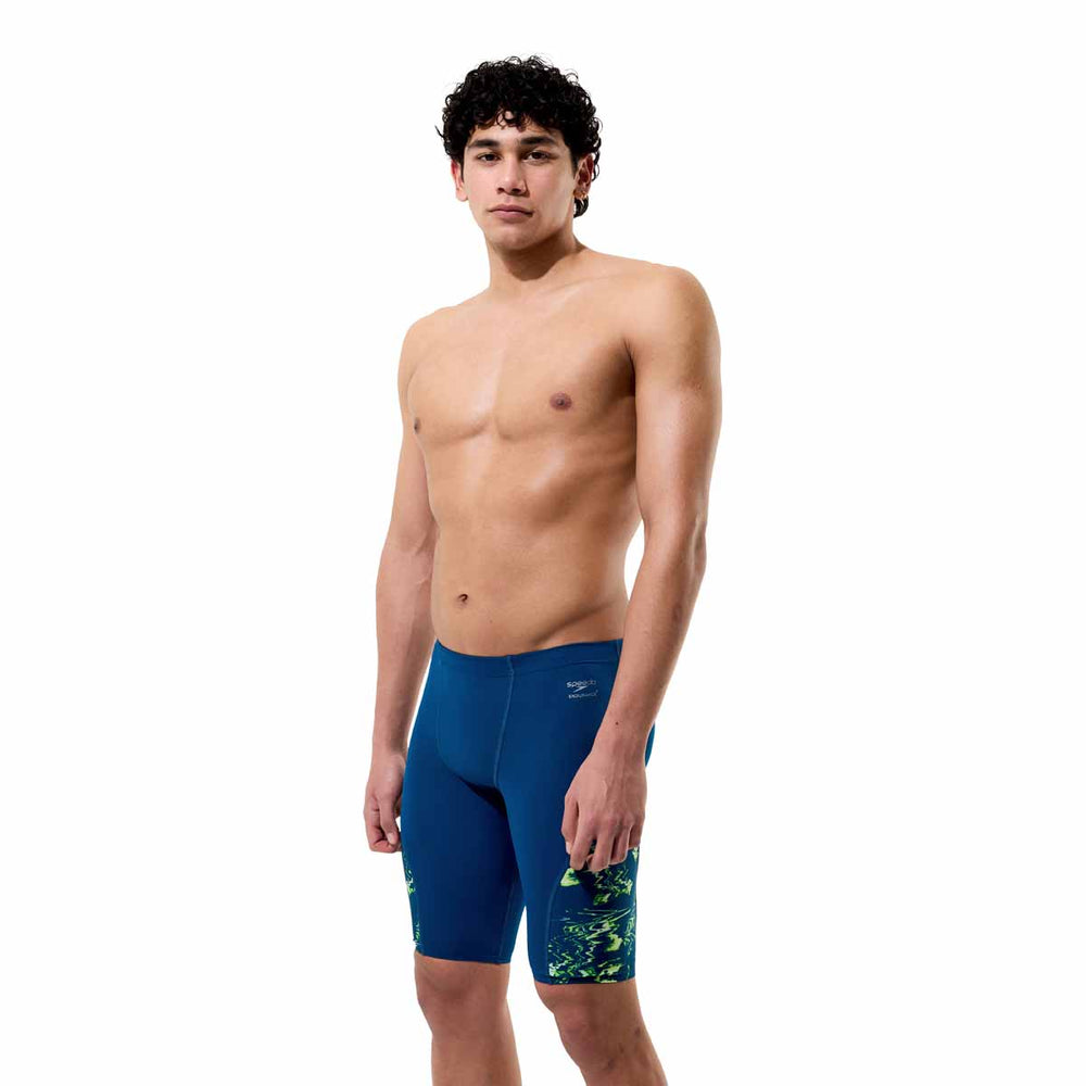Speedo men's spliced printed jammer in Mirage Time-Denim Teal with a colorful, patterned design for competitive swimming.