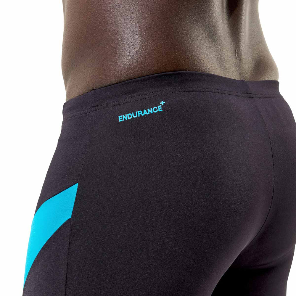 Speedo men's Hyperboom jammer in anthracite and hyper teal, showing close-up of fitted swimwear designed for competitive swimming.