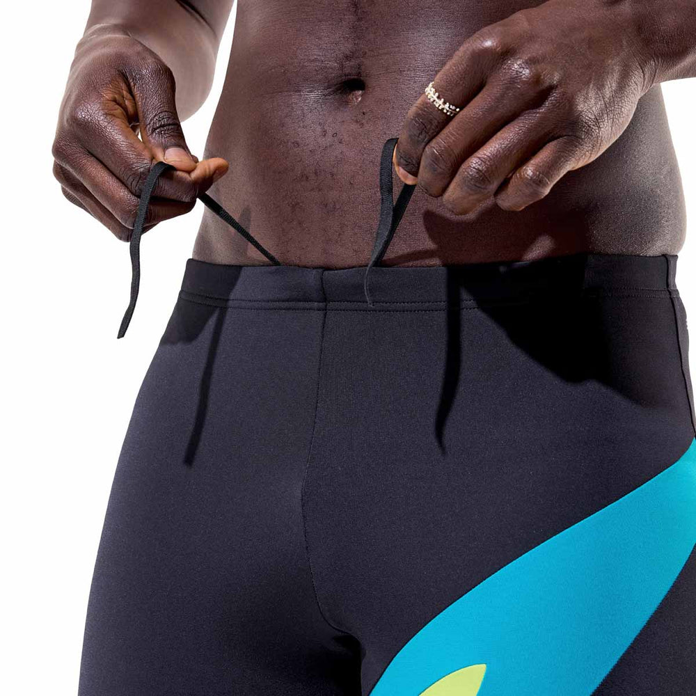 Speedo men's Hyperboom jammer in anthracite and hyper teal, featuring a close-up of the sleek swimwear fabric and design.