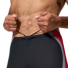 Speedo men's solid splice jammer swimsuit in anthracite and high risk red, featuring a sleek, fitted design for competitive swimming.