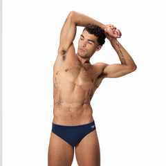 Speedo men's Endurance+ logo brief in peacoat color, 2.5-inch swimwear with logo detail, made for comfort and durability