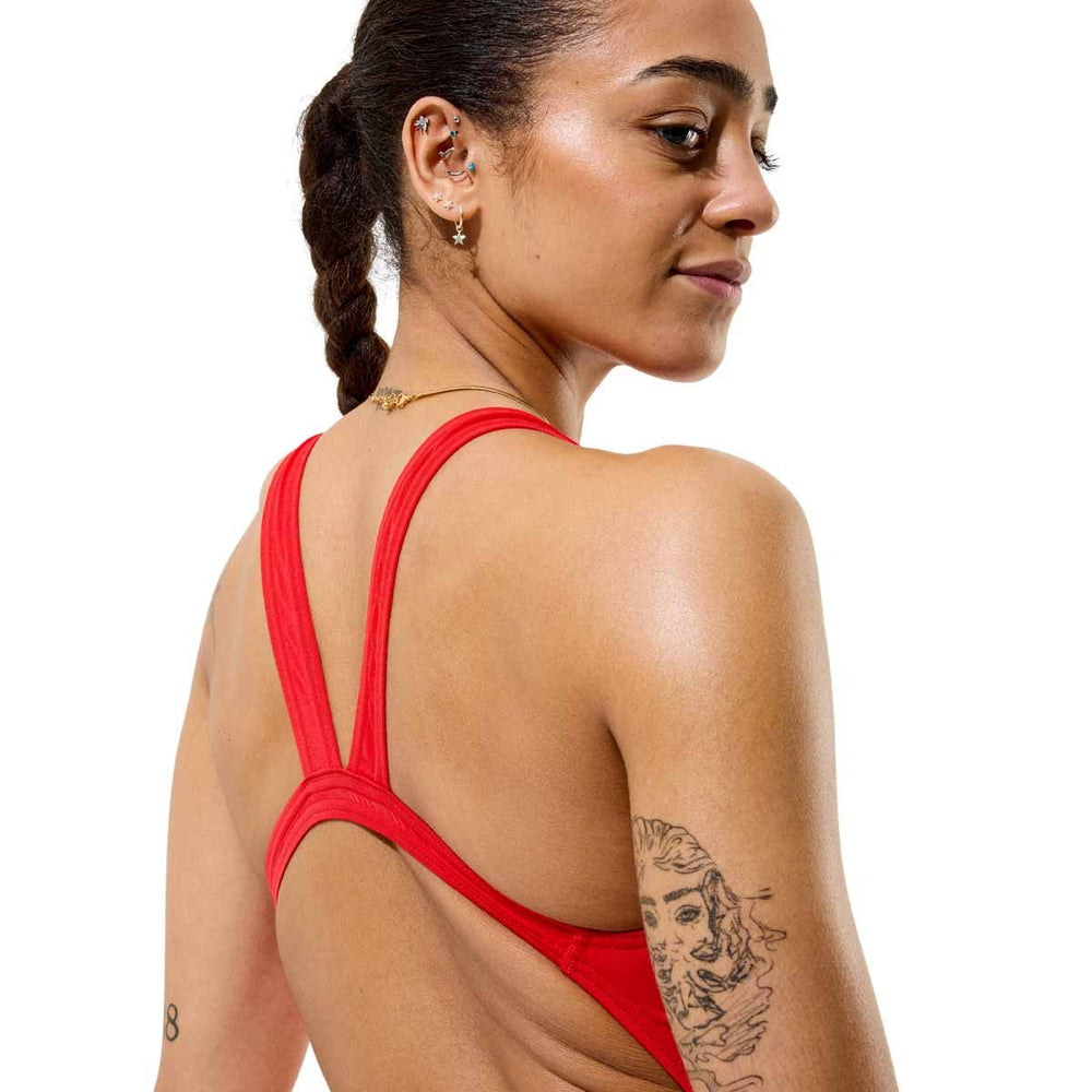 Speedo women's solid Endurance+ Max Leaderback swimsuit in team red, featuring a sleek design and supportive fit for swimming.