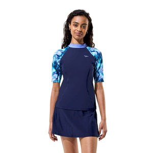 Navy Speedo women's swim skirt with built-in shorts, lightweight and comfortable for swimming and beach activities.