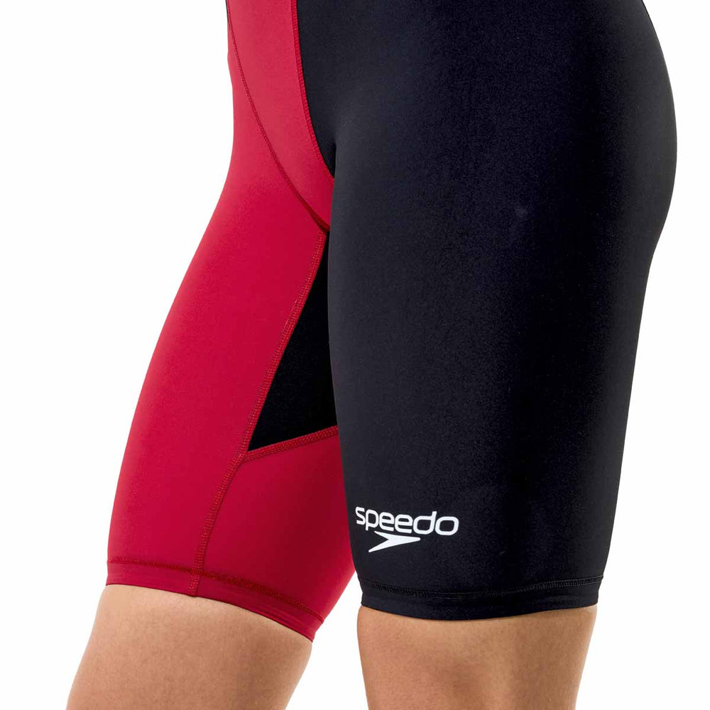 Speedo Women's Fastskin LZR HyperPro kneesuit in Regal Red and Black, showing sleek, form-fitting design for competitive swimming.