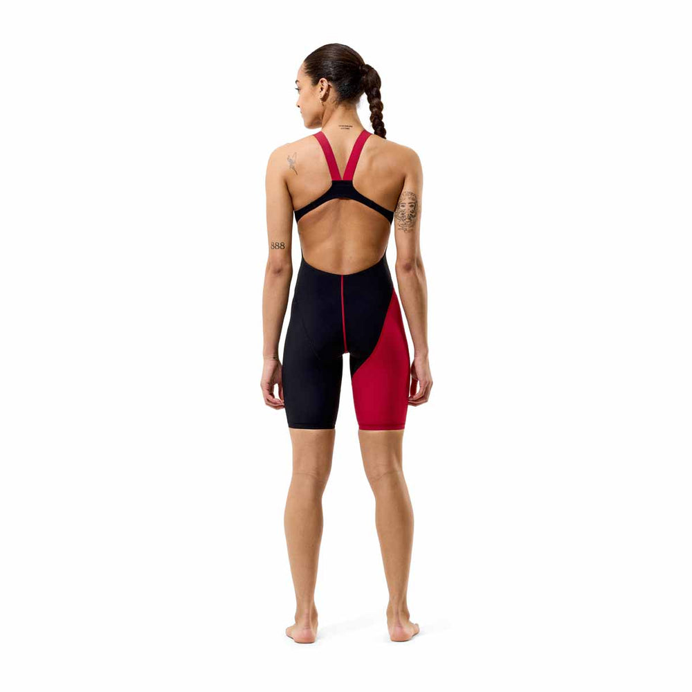 Speedo women's Fastskin LZR HyperPro kneesuit in regal red and black, sleek swimwear designed for competitive swimming.
