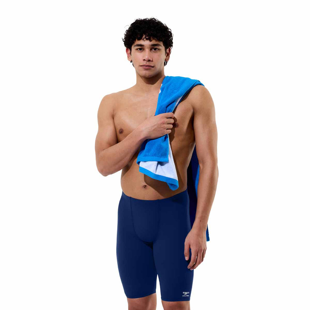 Speedo men's solid Endurance+ Max Jammer in navy, close-up of the fitted swim jammer with brand logo on the side.