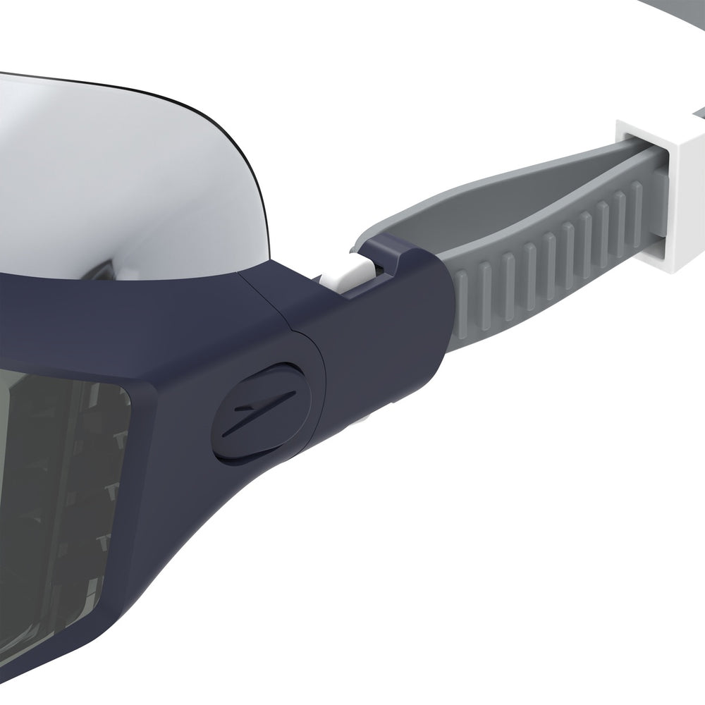 Speedo Aquapulse Pro swim goggles in peacoat and smoke color, featuring adjustable straps and a comfortable fit for swimming.