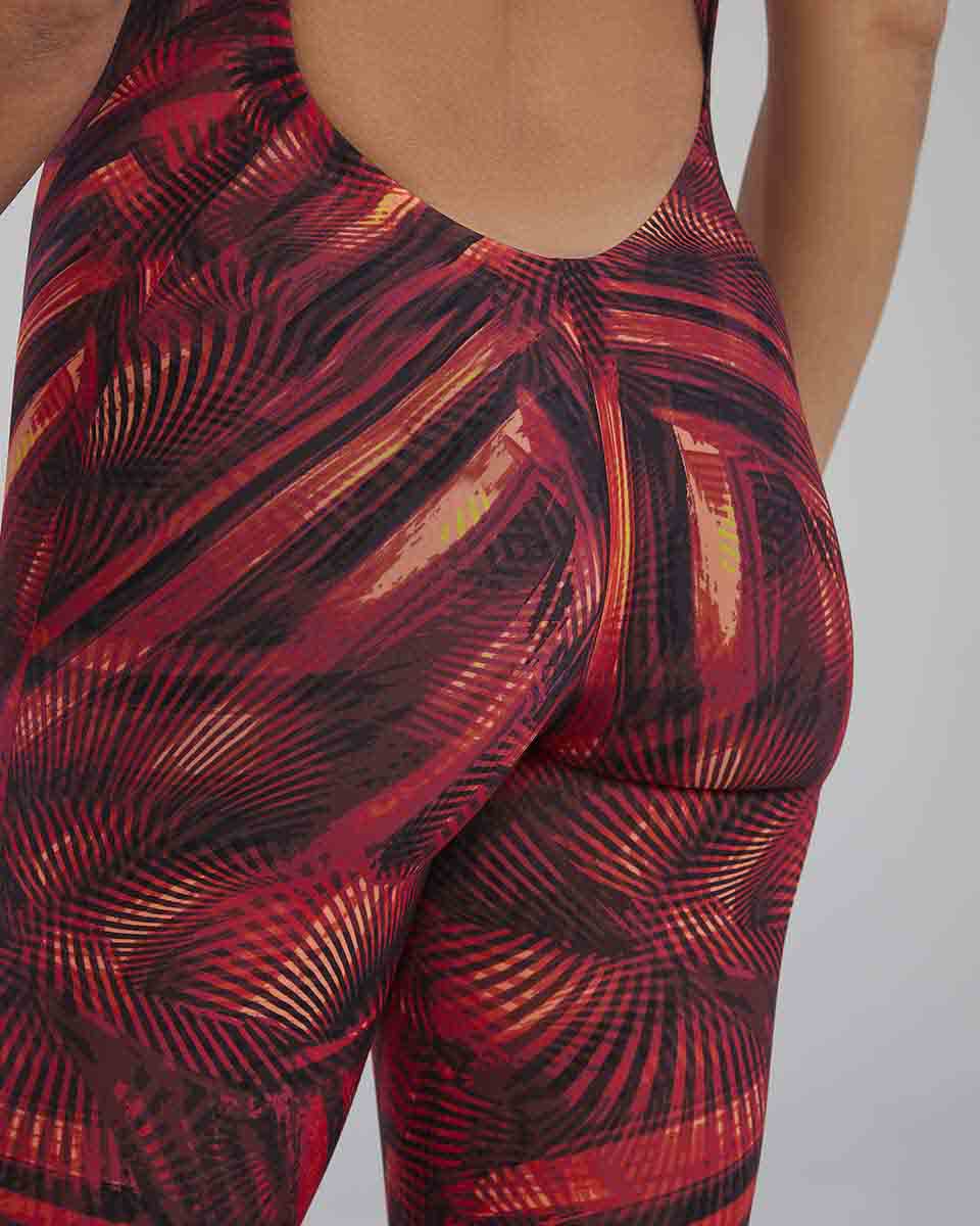 Red and orange TYR Avictor 2.0 Helux open-back women’s kneeskin swimsuit with sleek design and open back detail.