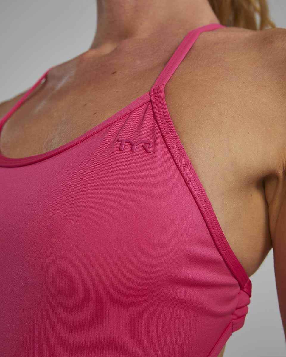 TYR women's solid fuchsia crosscut tieback swimsuit with high neckline and sleek design, perfect for swimming and active water sports.